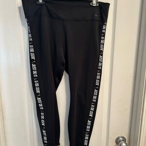 Nike Black Leggings Premium Performance Wear with Gold Cuffs and Logo detail